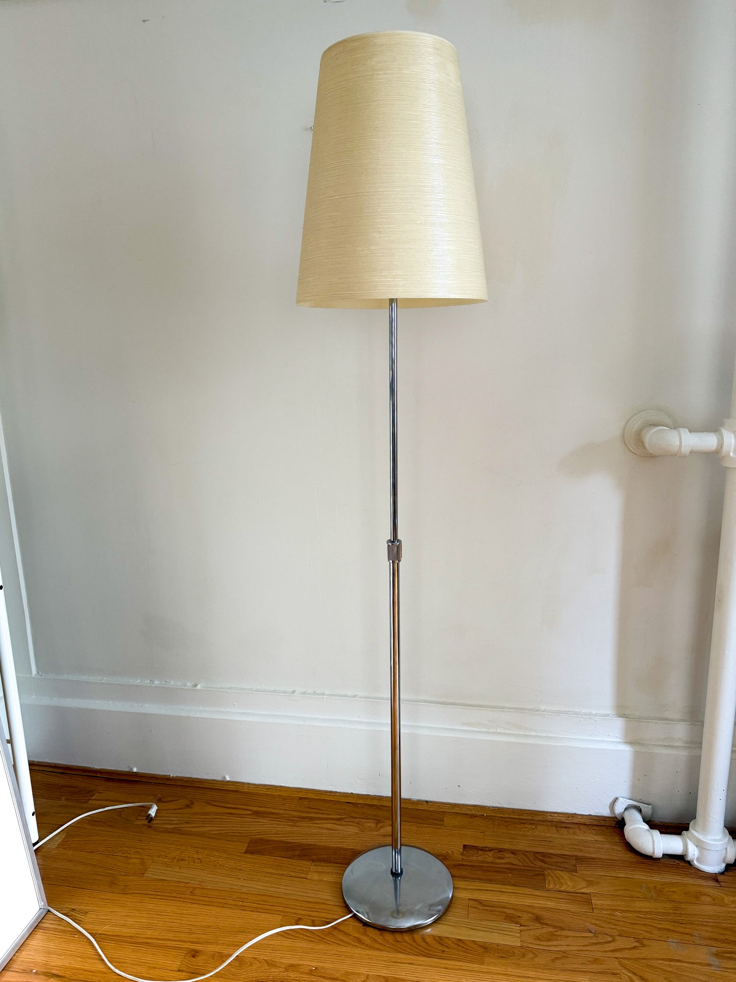 Adjustable chrome floor lamp by Lotte Lights